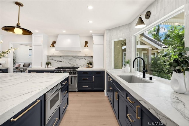 21210 Twin Oak, Yorba Linda, CA 92886 - kitchen with appliances with stainless steel finishes, custom exhaust hood, white cabinetry, decorative backsplash, and recessed lighting