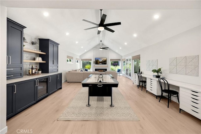 21210 Twin Oak, Yorba Linda, CA 92886 - playroom with a ceiling fan, light wood finished floors, a lit fireplace, beverage cooler, and vaulted ceiling