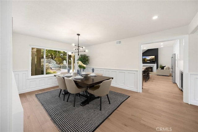 21210 Twin Oak, Yorba Linda, CA 92886 - dining room with a wainscoted wall, light wood-style floors, a decorative wall, a chandelier, and recessed lighting