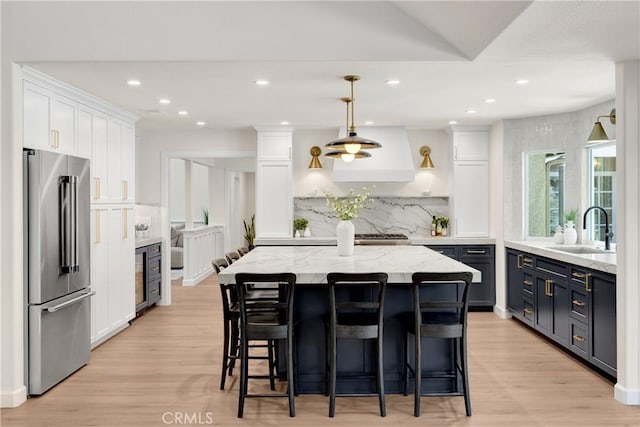 21210 Twin Oak, Yorba Linda, CA 92886 - kitchen with high end fridge, white cabinets, light wood-style flooring, and recessed lighting