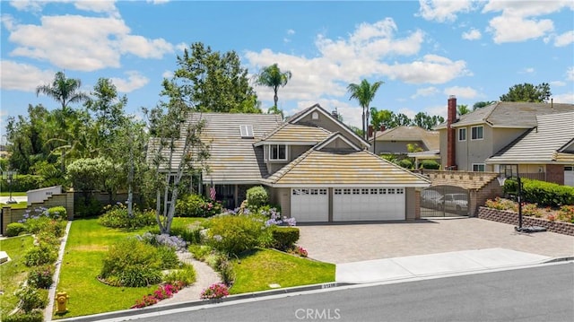 21210 Twin Oak, Yorba Linda, CA 92886 - view of front of house with decorative driveway, an attached garage, and a tiled roof