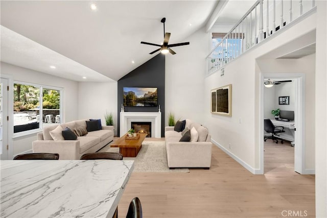 21210 Twin Oak, Yorba Linda, CA 92886 - living room featuring ceiling fan, an office area, light wood-style floors, recessed lighting, and a warm lit fireplace
