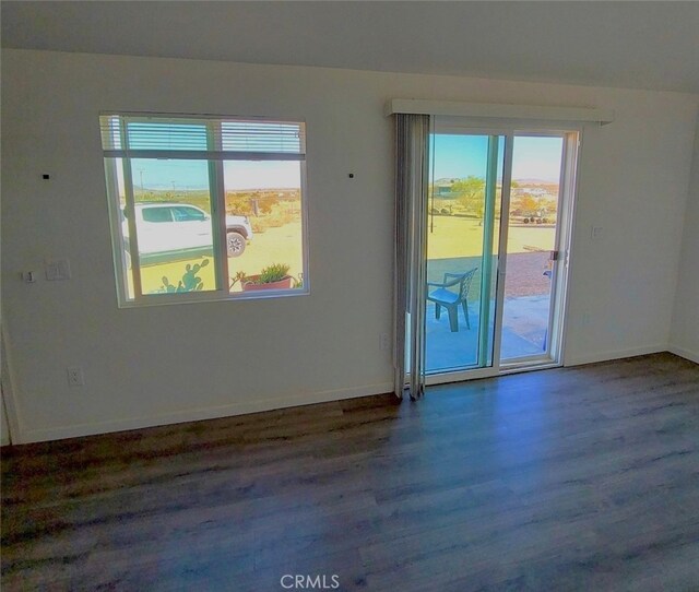 56133 Jesse Rd, Landers, CA 92285 - empty room with wood finished floors and healthy amount of natural light