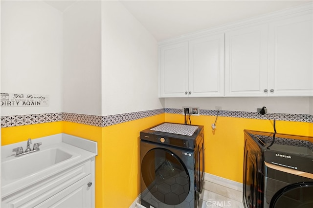 28426 Joey Ct, Menifee, CA 92585 - laundry area featuring cabinet space and light tile patterned flooring