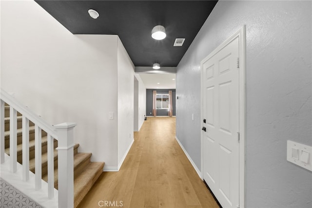 28426 Joey Ct, Menifee, CA 92585 - corridor featuring light wood-style flooring and stairs