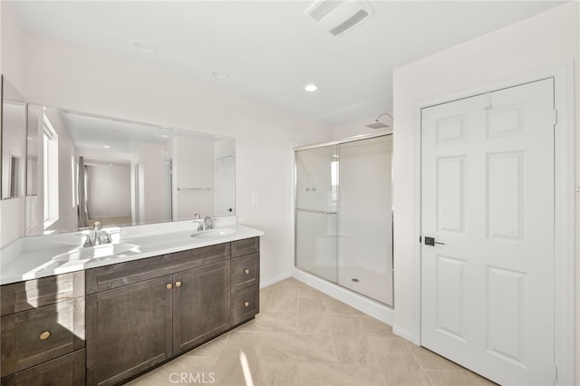 28426 Joey Ct, Menifee, CA 92585 - bathroom with a shower stall, double vanity, and recessed lighting