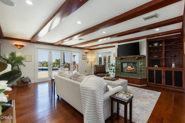 3626 Saint Elizabeth Rd, Glendale, CA 91206 - living room featuring plenty of natural light, a tile fireplace, french doors, beam ceiling, and dark wood finished floors