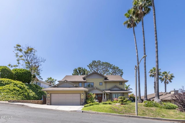 3626 Saint Elizabeth Rd, Glendale, CA 91206 - craftsman house with an attached garage, concrete driveway, stone siding, and a front yard
