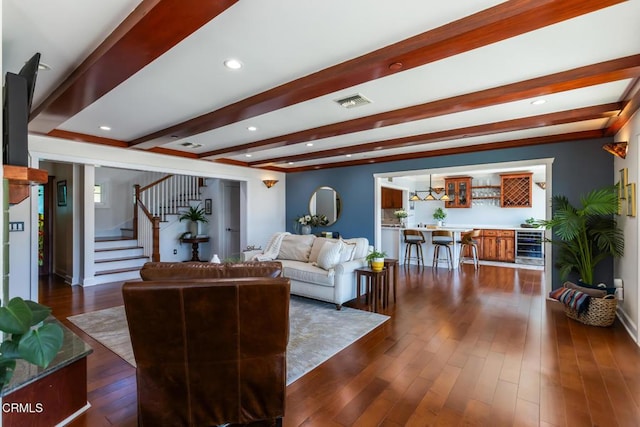 3626 Saint Elizabeth Rd, Glendale, CA 91206 - living room with beverage cooler, beamed ceiling, stairway, dark wood finished floors, and recessed lighting