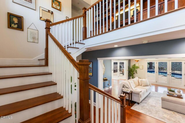 3626 Saint Elizabeth Rd, Glendale, CA 91206 - staircase featuring wood finished floors, french doors, and recessed lighting