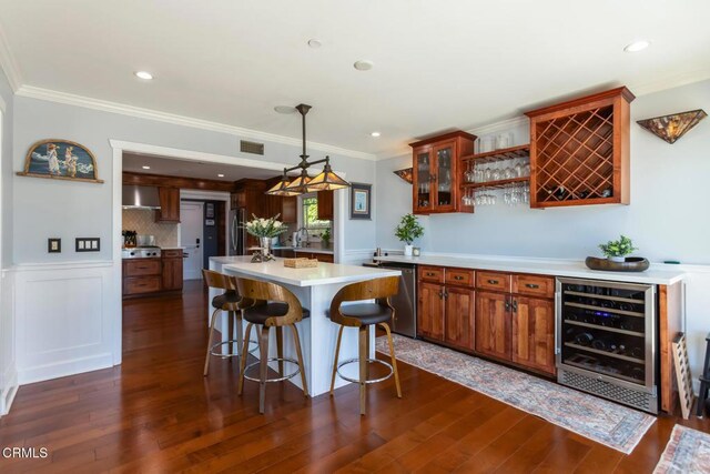 3626 Saint Elizabeth Rd, Glendale, CA 91206 - kitchen featuring beverage cooler, wall chimney exhaust hood, light countertops, dark wood-type flooring, and stainless steel appliances