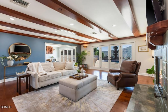 3626 Saint Elizabeth Rd, Glendale, CA 91206 - living area with beamed ceiling, wood finished floors, recessed lighting, french doors, and a lit fireplace