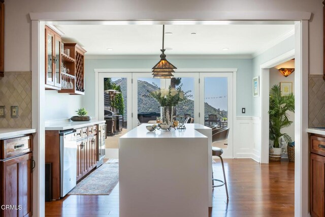 3626 Saint Elizabeth Rd, Glendale, CA 91206 - dining area with dark wood finished floors, wainscoting, and crown molding