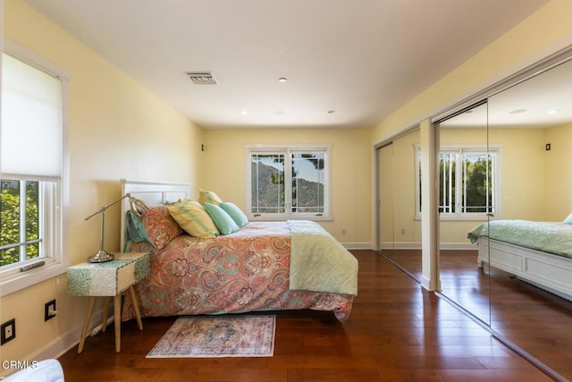 3626 Saint Elizabeth Rd, Glendale, CA 91206 - bedroom featuring multiple windows, wood-type flooring, two closets, and recessed lighting