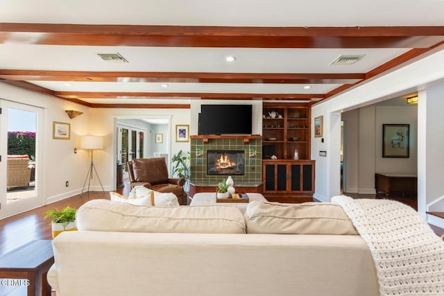3626 Saint Elizabeth Rd, Glendale, CA 91206 - living room featuring beamed ceiling, wood finished floors, a tile fireplace, and recessed lighting