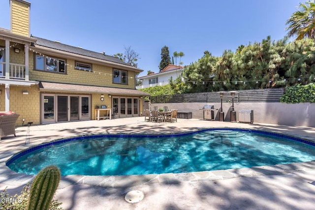 3626 Saint Elizabeth Rd, Glendale, CA 91206 - view of swimming pool with a patio area, area for grilling, and french doors
