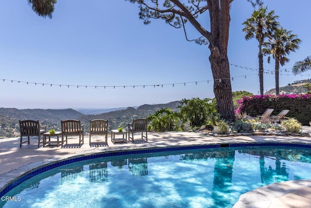 3626 Saint Elizabeth Rd, Glendale, CA 91206 - outdoor pool with a mountain view and a patio area