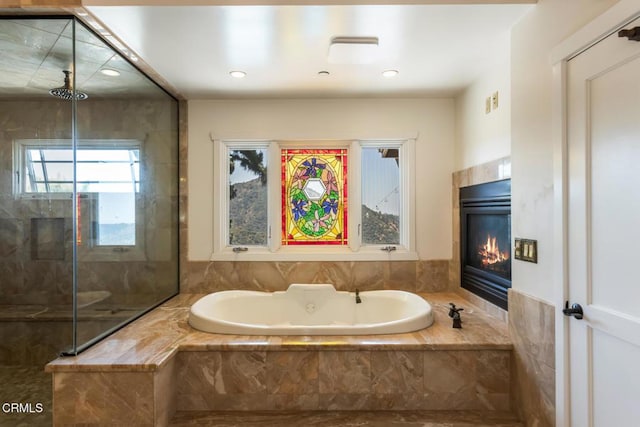 3626 Saint Elizabeth Rd, Glendale, CA 91206 - bathroom featuring a bath, a fireplace, a stall shower, and recessed lighting