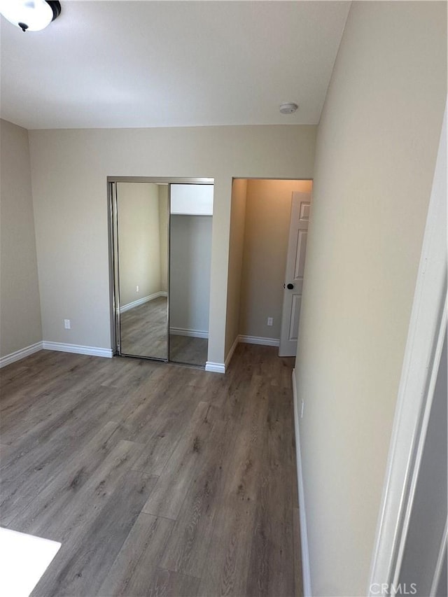 2311 5th St, Riverside, CA 92507 - unfurnished bedroom with wood finished floors and a closet