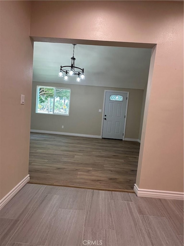 2311 5th St, Riverside, CA 92507 - entryway with a chandelier and wood finished floors