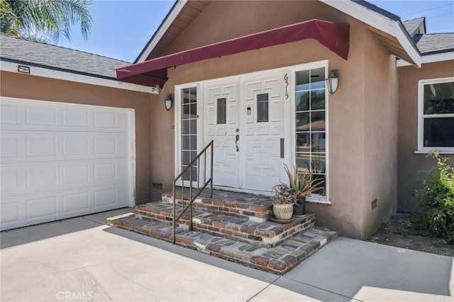 6515 Amigo Ave, Reseda, CA 91335 - view of exterior entry featuring stucco siding, a shingled roof, and concrete driveway