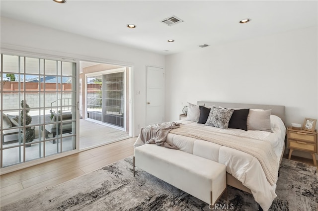 6515 Amigo Ave, Reseda, CA 91335 - bedroom featuring access to exterior, wood finished floors, and recessed lighting