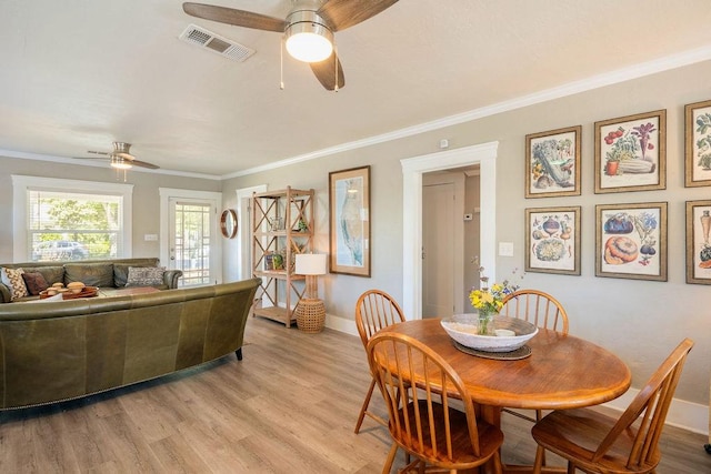 1396 N Ferger Ave, Fresno, CA 93728 - dining room with ceiling fan, light wood-style floors, and ornamental molding