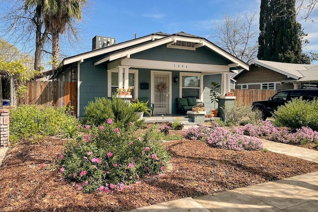 1396 N Ferger Ave, Fresno, CA 93728 - view of front of home featuring covered porch and a chimney