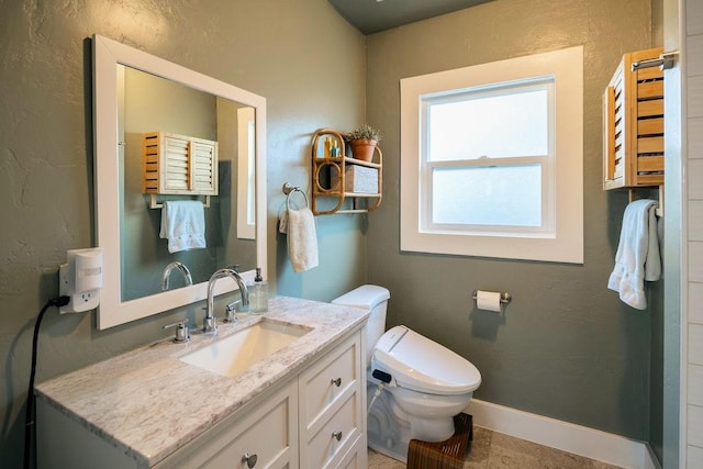 1396 N Ferger Ave, Fresno, CA 93728 - bathroom featuring vanity and a textured wall