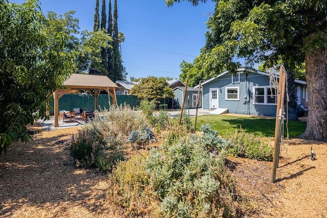 1396 N Ferger Ave, Fresno, CA 93728 - view of green lawn with a gazebo and a patio area