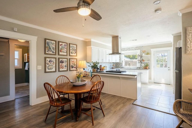 1396 N Ferger Ave, Fresno, CA 93728 - dining area with ornamental molding, wood finished floors, and a ceiling fan