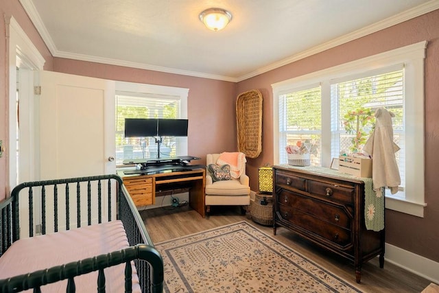 1396 N Ferger Ave, Fresno, CA 93728 - bedroom with wood finished floors, multiple windows, ornamental molding, and a desk