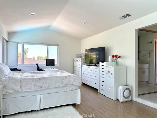 2227 Langspur Dr, Hacienda Heights, CA 91745 - bedroom featuring lofted ceiling, light wood-style flooring, and ensuite bathroom