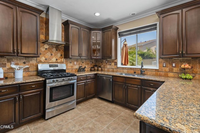 3328 Whispering Palms, Pico Rivera, CA 90660 - kitchen with wall chimney exhaust hood, stainless steel appliances, ornamental molding, dark brown cabinets, and decorative backsplash