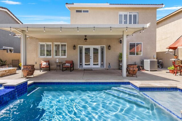 3328 Whispering Palms, Pico Rivera, CA 90660 - back of house with french doors, stucco siding, a jacuzzi, a patio area, and an outdoor pool