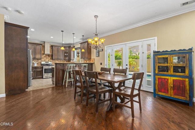 3328 Whispering Palms, Pico Rivera, CA 90660 - dining space with french doors, a chandelier, crown molding, recessed lighting, and dark wood-style flooring