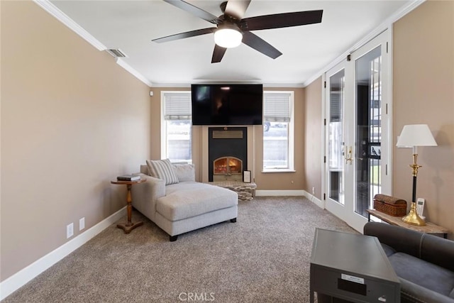 18310 Canon St, Devore, CA 92407 - carpeted living area featuring crown molding, a warm lit fireplace, and ceiling fan