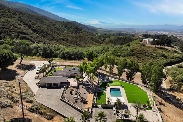 18310 Canon St, Devore, CA 92407 - drone / aerial view of a pool area and a mountain backdrop