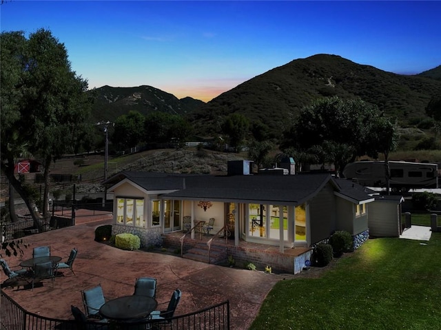 18310 Canon St, Devore, CA 92407 - rear view of property with a mountain view and a patio area