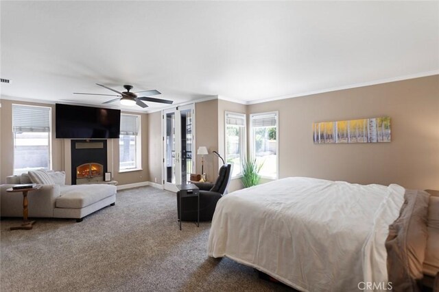 18310 Canon St, Devore, CA 92407 - bedroom with ornamental molding, carpet floors, a warm lit fireplace, and ceiling fan