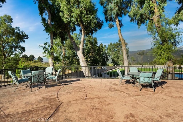 18310 Canon St, Devore, CA 92407 - view of patio / terrace featuring outdoor dining space and a mountain view