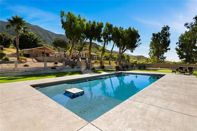 18310 Canon St, Devore, CA 92407 - view of swimming pool featuring a mountain view and a patio
