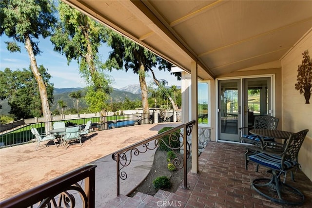 18310 Canon St, Devore, CA 92407 - view of patio featuring a mountain view and outdoor dining space