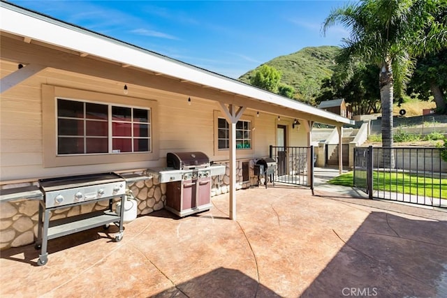 18310 Canon St, Devore, CA 92407 - view of patio featuring area for grilling, a mountain view, and a gate