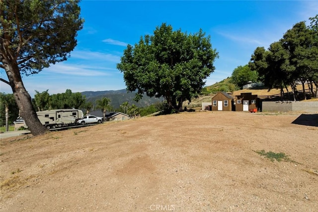 18310 Canon St, Devore, CA 92407 - view of yard featuring a mountain view