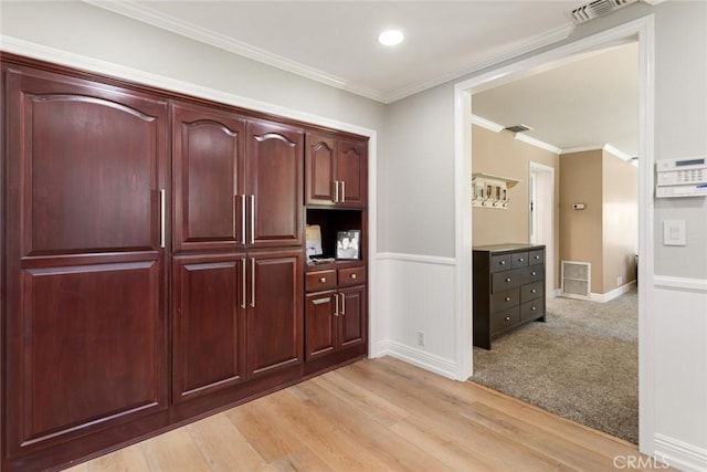 18310 Canon St, Devore, CA 92407 - kitchen featuring dark brown cabinets, a wainscoted wall, light wood finished floors, ornamental molding, and recessed lighting