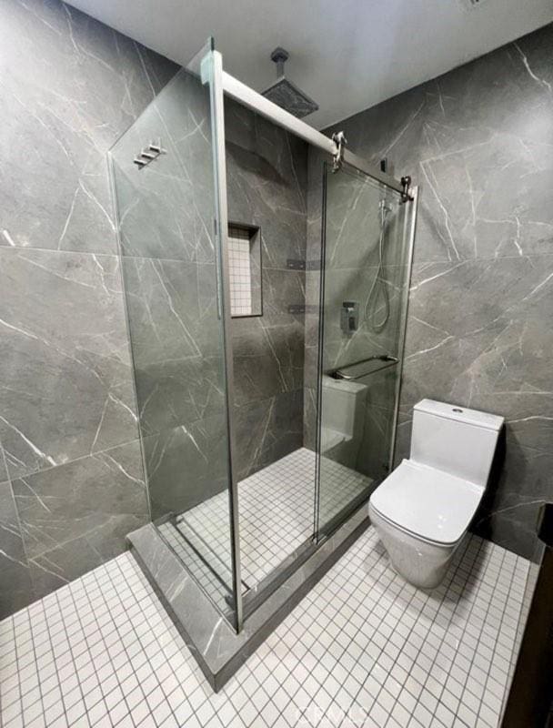2727 Pine Creek Cir, Fullerton, CA 92835 - full bathroom with tile walls, a marble finish shower, and tile patterned flooring