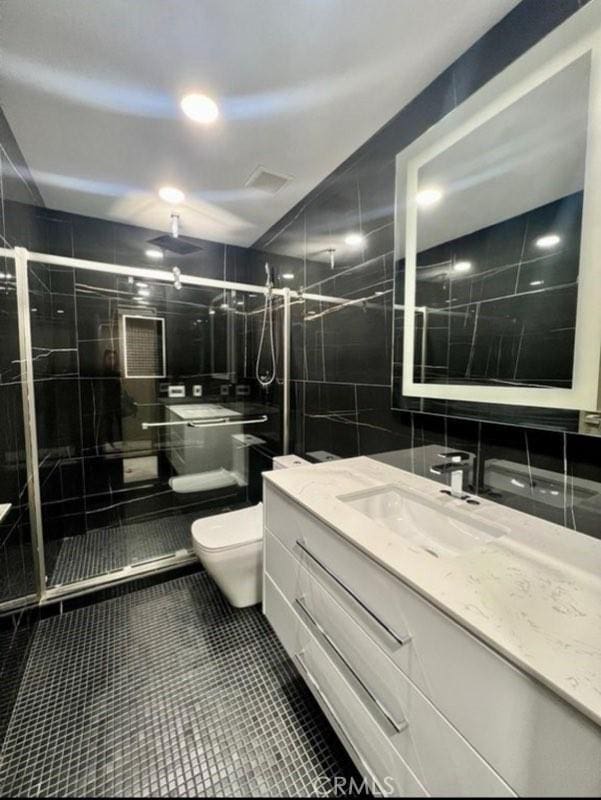 2727 Pine Creek Cir, Fullerton, CA 92835 - full bath with tile walls, vanity, a stall shower, and tile patterned flooring