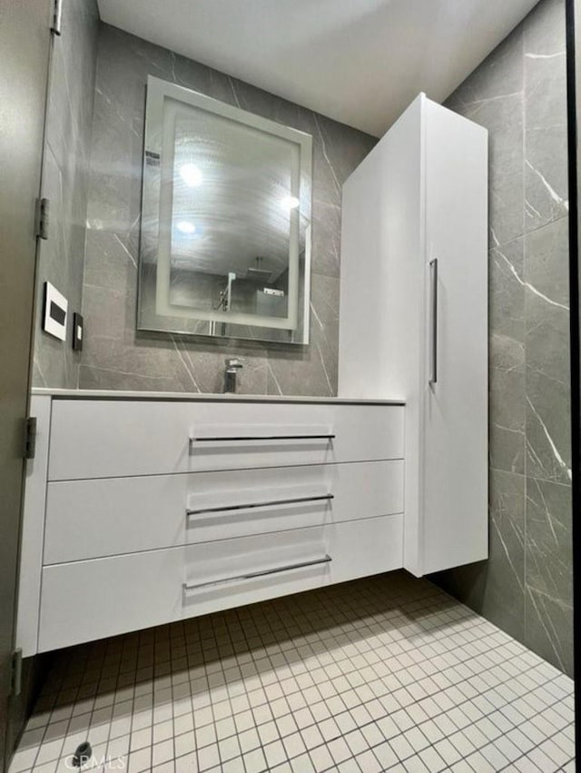 2727 Pine Creek Cir, Fullerton, CA 92835 - bathroom featuring tile walls, vanity, and tile patterned flooring