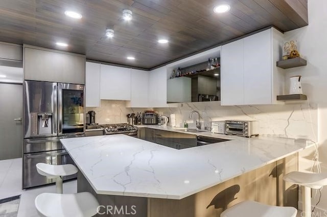 2727 Pine Creek Cir, Fullerton, CA 92835 - kitchen featuring stainless steel refrigerator with ice dispenser, open shelves, a peninsula, light stone counters, and tasteful backsplash